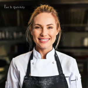 Avatar of a smiling female chef in a kitchen setting, exuding warmth and friendliness